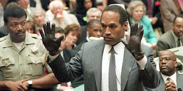 OJ Simpson tries on his murder gloves